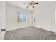 Spacious bedroom featuring a ceiling fan, window, and neutral carpet at 965 Nevada State Dr # 6101, Henderson, NV 89002