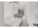 Bright bedroom with a ceiling fan, large window, and cozy carpet at 965 Nevada State Dr # 6101, Henderson, NV 89002