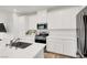 Clean white kitchen featuring stainless steel appliances and quartz countertops at 965 Nevada State Dr # 6101, Henderson, NV 89002