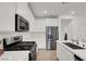 Modern kitchen featuring stainless steel appliances and white cabinetry at 965 Nevada State Dr # 6101, Henderson, NV 89002