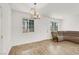 Bright living room featuring wood-look tile flooring and a modern chandelier at 965 Nevada State Dr # 6101, Henderson, NV 89002