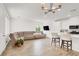 Spacious living room with a large sectional sofa, flat-screen TV, and kitchen view at 965 Nevada State Dr # 6101, Henderson, NV 89002