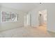 Inviting bedroom with large window for natural light, neutral carpet, and adjoined bathroom and walk in closet at , Las Vegas, NV 89117