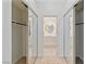 Closet with mirrored doors leading to a bathroom with custom vanity and a backlit circular mirror at , Las Vegas, NV 89117