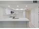 Modern kitchen with white cabinets, quartz countertops, and stainless steel appliances at , Las Vegas, NV 89117