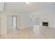 Open-concept living room with a fireplace, tiled floors, and ample natural light at , Las Vegas, NV 89117