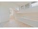 Bright loft area with natural light, neutral colors, and modern railing detail create an airy and inviting space at , Las Vegas, NV 89117