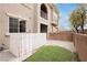 Backyard with turf, brick pavers, and a partial view of the home's exterior at 10091 Sand Key St, Las Vegas, NV 89178