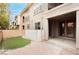 Backyard with a small turf area, brick pavers, and access to the home at 10091 Sand Key St, Las Vegas, NV 89178