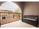 Balcony area with a bench and metal railing overlooking neighborhood at 10091 Sand Key St, Las Vegas, NV 89178