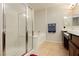 Bright bathroom featuring a bathtub, shower, and double sinks with ample counter space at 10091 Sand Key St, Las Vegas, NV 89178