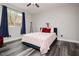 Comfortable bedroom showcasing wood-look floors and natural light at 10091 Sand Key St, Las Vegas, NV 89178