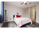 Cozy bedroom featuring wood-look flooring and a ceiling fan at 10091 Sand Key St, Las Vegas, NV 89178