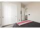 Bedroom with closet doors and view to another room through an open door at 10091 Sand Key St, Las Vegas, NV 89178