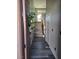 Inviting entryway featuring hardwood flooring and stairs leading to the upper level, with a wreath on the door at 10091 Sand Key St, Las Vegas, NV 89178
