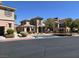 Beautiful multi-level apartment complex with well maintained landscape and visible handicap parking spots at 10091 Sand Key St, Las Vegas, NV 89178