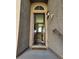 Front entrance showcasing a covered entryway leading to the home's interior, textured walls at 10091 Sand Key St, Las Vegas, NV 89178