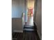 Hallway with wood-look floors leading into a bedroom at 10091 Sand Key St, Las Vegas, NV 89178