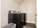 Laundry room showcasing a gray washer and dryer at 10091 Sand Key St, Las Vegas, NV 89178
