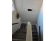 Staircase with wood-look floors and a bright white railing at 10091 Sand Key St, Las Vegas, NV 89178