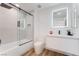 Modern bathroom featuring a shower over tub with glass screen and sleek vanity at 10809 Garden Mist Dr # 2072, Las Vegas, NV 89135