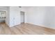 An airy bedroom featuring a closet with sliding doors and wood-look flooring at 10809 Garden Mist Dr # 2072, Las Vegas, NV 89135