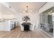 Bright dining room features a modern light fixture and sliding glass doors to the patio at 10809 Garden Mist Dr # 2072, Las Vegas, NV 89135