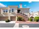 Condominium building featuring well-kept landscaping, attached garages, and private entrances at 10809 Garden Mist Dr # 2072, Las Vegas, NV 89135