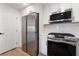 A well-equipped kitchen featuring stainless steel appliances and bright white cabinetry at 10809 Garden Mist Dr # 2072, Las Vegas, NV 89135