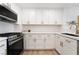 The gourmet kitchen features white countertops, cabinetry, and stainless steel appliances at 10809 Garden Mist Dr # 2072, Las Vegas, NV 89135