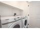 Convenient laundry room with modern washer and dryer, plus storage space at 10809 Garden Mist Dr # 2072, Las Vegas, NV 89135