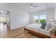 Bright main bedroom featuring a ceiling fan and natural light from the large windows at 10809 Garden Mist Dr # 2072, Las Vegas, NV 89135