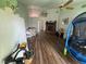 Spacious living area showcasing a brick fireplace, hardwood floors, and ample room for relaxation at 1104 Oak Tree Ln, Las Vegas, NV 89108