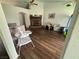 Spacious living area showcasing a brick fireplace, hardwood floors, and ample room for relaxation at 1104 Oak Tree Ln, Las Vegas, NV 89108