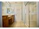 This bathroom has dual sinks, a tiled floor and a walk-in shower at 1241 Gingerbread Man Ave, Las Vegas, NV 89183