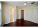 Bedroom features hardwood floors, ceiling fan, and easy access to the en-suite bathroom at 1241 Gingerbread Man Ave, Las Vegas, NV 89183