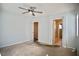This bedroom has a ceiling fan, carpeted floors, and an ensuite bathroom with walk-in shower at 1241 Gingerbread Man Ave, Las Vegas, NV 89183