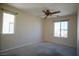 Neutral bedroom featuring two windows for natural light and carpeted floors at 1241 Gingerbread Man Ave, Las Vegas, NV 89183