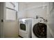 Convenient laundry room featuring modern washer and dryer units with a window at 1241 Gingerbread Man Ave, Las Vegas, NV 89183