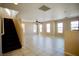 Spacious living room with tile floors, neutral walls, and a ceiling fan at 1241 Gingerbread Man Ave, Las Vegas, NV 89183