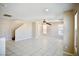Spacious living room with tile floors, neutral walls, and a ceiling fan at 1241 Gingerbread Man Ave, Las Vegas, NV 89183