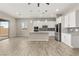 Bright, modern kitchen featuring stainless steel appliances, an island, and stylish backsplash at 12550 Point Sierra St, Las Vegas, NV 89138