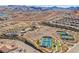 Aerial view of the luxurious community amenities, with pools, clubhouse, and recreational courts at 127 Crimson Cactus Ave, Henderson, NV 89011