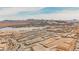 Expansive aerial view of the community and Lake Las Vegas with majestic mountains in the background at 127 Crimson Cactus Ave, Henderson, NV 89011