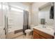 Well-lit bathroom includes a single sink vanity, toilet, and shower with curtain rod at 127 Crimson Cactus Ave, Henderson, NV 89011