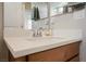 Modern bathroom vanity boasts a white countertop, stylish faucet, and wood cabinetry at 127 Crimson Cactus Ave, Henderson, NV 89011