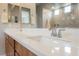 Close-up of bathroom vanity with dual sinks, modern faucets, and white countertop at 127 Crimson Cactus Ave, Henderson, NV 89011