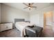 Comfortable bedroom featuring a queen bed, soft daybed, and a ceiling fan at 127 Crimson Cactus Ave, Henderson, NV 89011