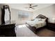 Primary bedroom suite features a ceiling fan, a window providing natural light, and warm neutral decor at 127 Crimson Cactus Ave, Henderson, NV 89011