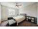 Cozy bedroom showcasing a ceiling fan, comfortable queen bed, and a plush daybed at 127 Crimson Cactus Ave, Henderson, NV 89011